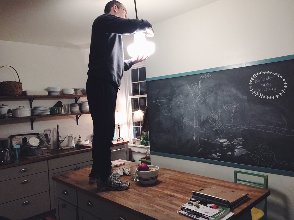 Dan changing out the kitchen pendant light. Won't have to do this again for a VERY long time.